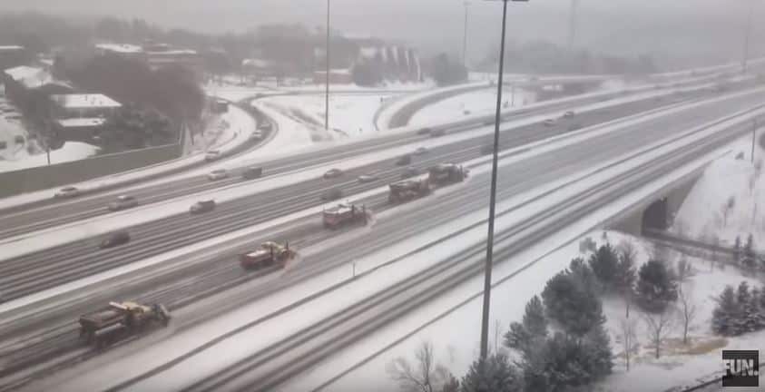 Fleet of 22 Snowplows Clearing Roads in Toronto